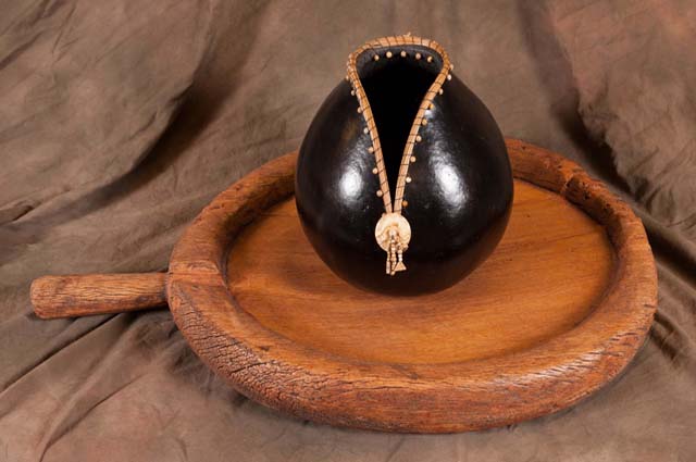 Black Columbia River Gourd On Wooden Sun Cook Board